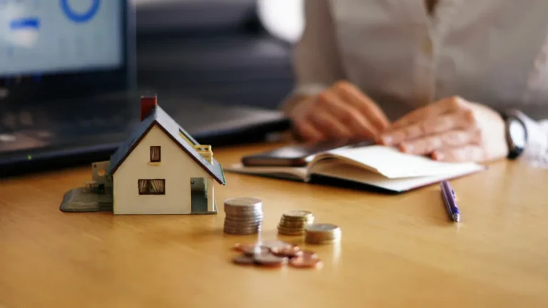 Home Affordability Calculator with house model, coins, and person analyzing mortgage affordability and budget planning.