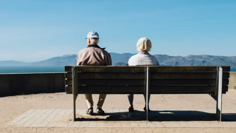 IRA retirement planning concept showing a senior couple enjoying financial freedom after building wealth through 401(k) and IRA savings