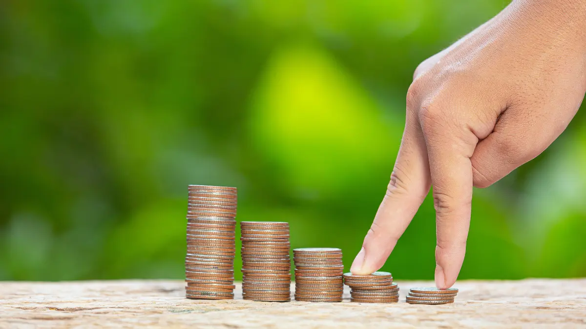 Capital Gains Tax concept showing stacked coins and investment growth strategy