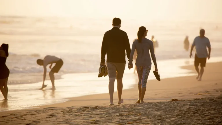 Couple walking on beach symbolizing life journey savings with Cheap Insurance strategies in 2026