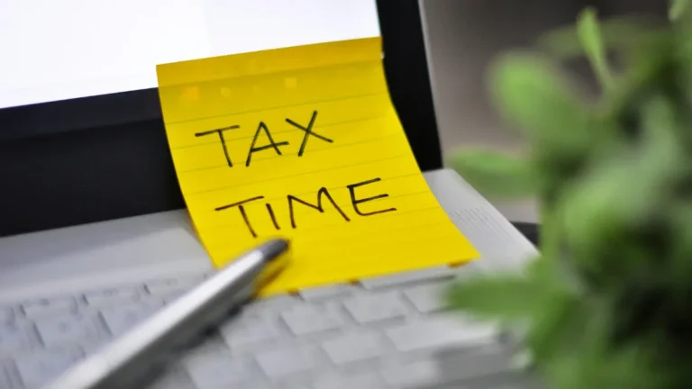 GST tax filing reminder showing tax time note on laptop