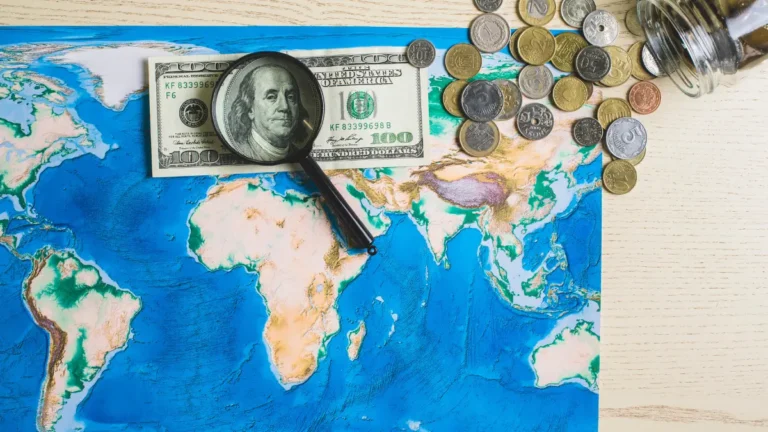 Inland Revenue global taxation concept with world map, currency, and financial investigation