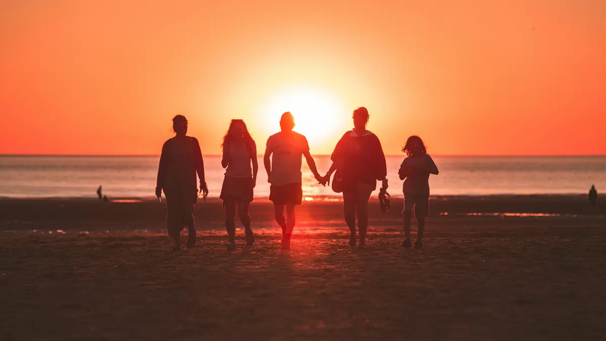 Family walking together at sunset symbolizing Life Insurance financial protection and future security