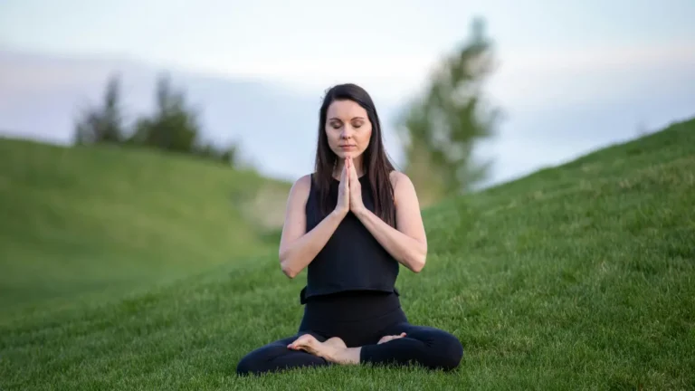 Woman meditating outdoors representing peace of mind with a Medicare Advantage Plan in 2026