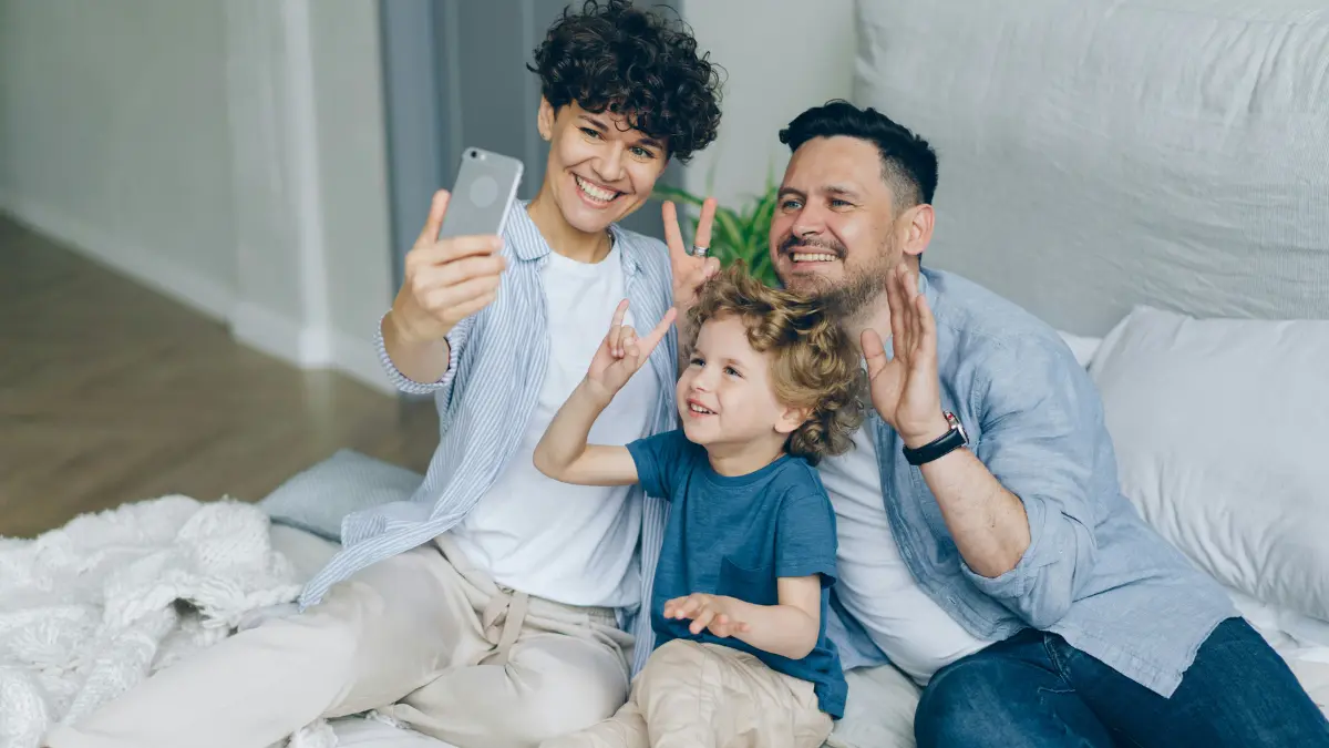 Happy family taking a selfie together representing financial protection through Term Insurance