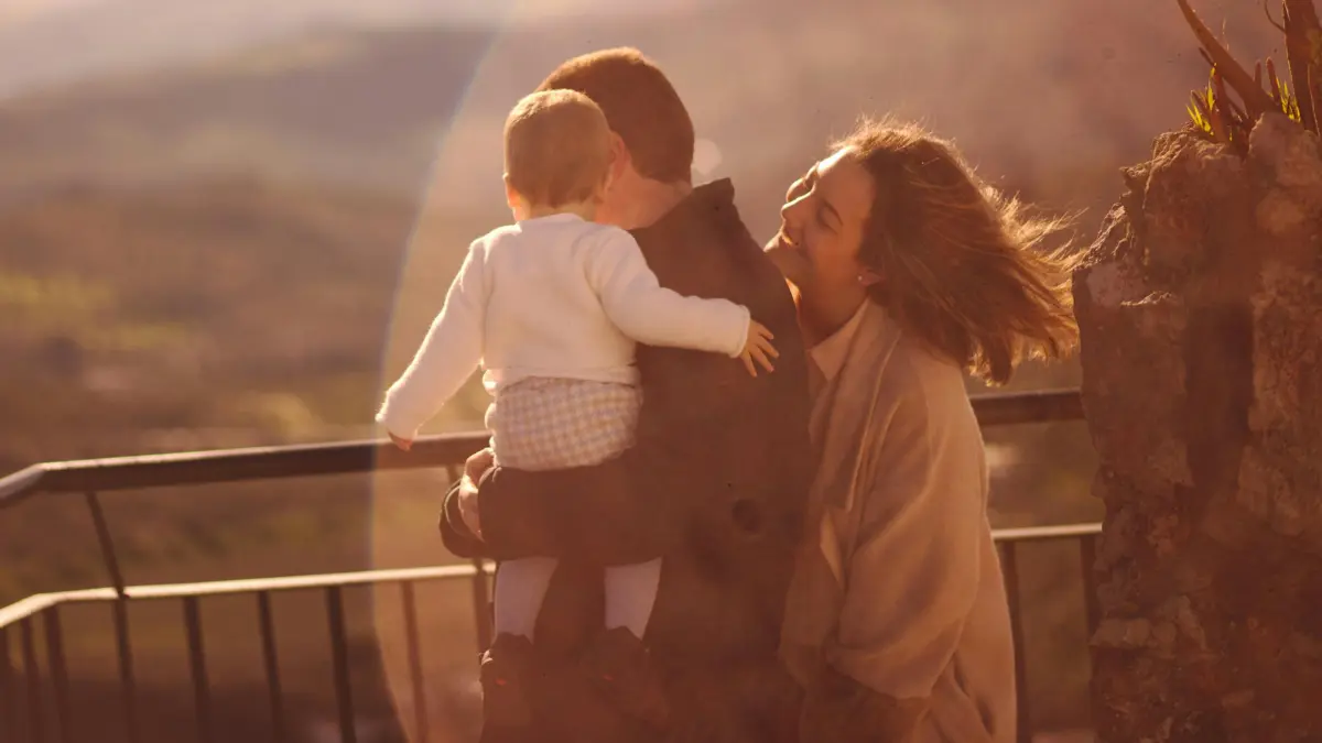 Young family enjoying sunset together symbolizing financial security from Term Life Insurance