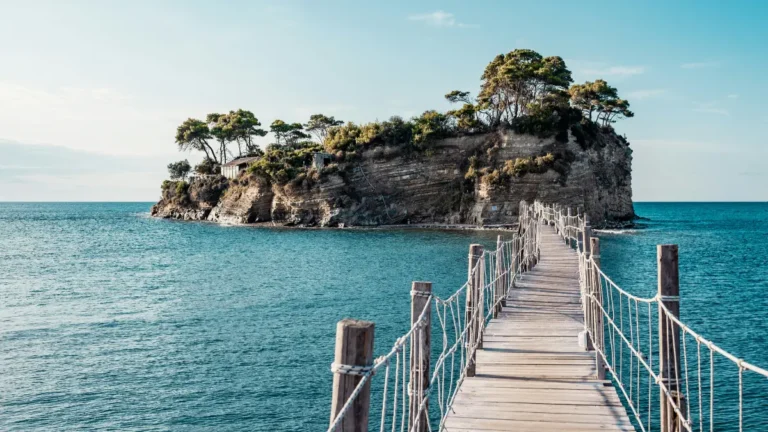 Travel Insurance planning for international trip showing traveler path to island destination