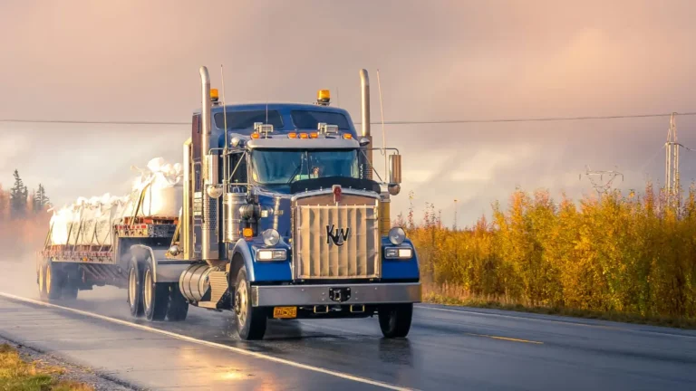 Commercial semi truck driving on highway representing Truck Insurance costs and coverage in 2026