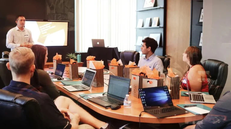 Overtime Calculator workplace meeting discussing employee work hours overtime pay and productivity tracking