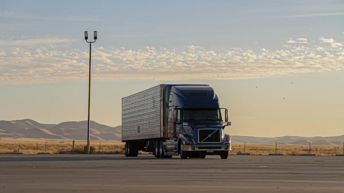 Tractor Trailer Insurance commercial semi truck parked on highway landscape representing long haul trucking industry